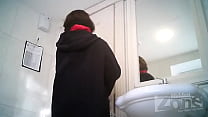 woman with tampon pissing at toilet with spy cam